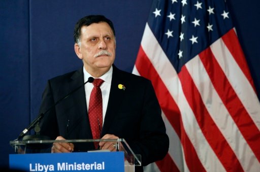 Mohamad Ali Harissi | Libyan Prime Minister-designate Fayez al-Sarraj (L) addresses a press conference on May 16, 2016 in Vienna, Austria 