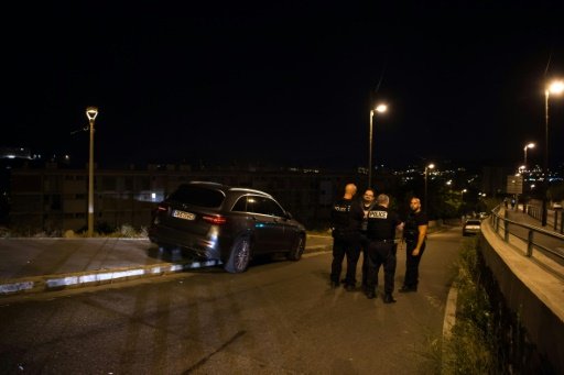 Police officers investigate a crime scene after two men were shot dead in Marseille, southern France. - AFP Photo