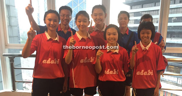 The Girl’s U18 paddlers with head coach Chung Kui Chai (left, back row) and other team officials.