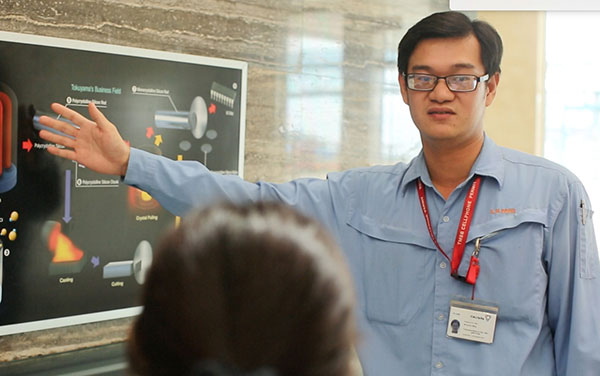 Bong gives a briefing on the process of production at the plant.