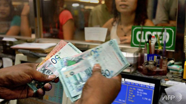The most secure sectors had the majority of earnings come from Malaysia, CIMB Research added, whereby costs are largely ringgit denominated. — AFP photo  