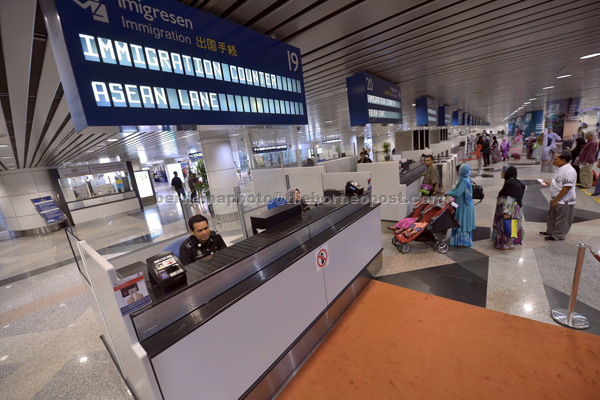 File photo shows international passengers going through KLIA’s immigration points. International traffic for KLIA also grew by four per cent supported by improved passenger traffic from Northeast Asia and West Asia. — Bernama photo