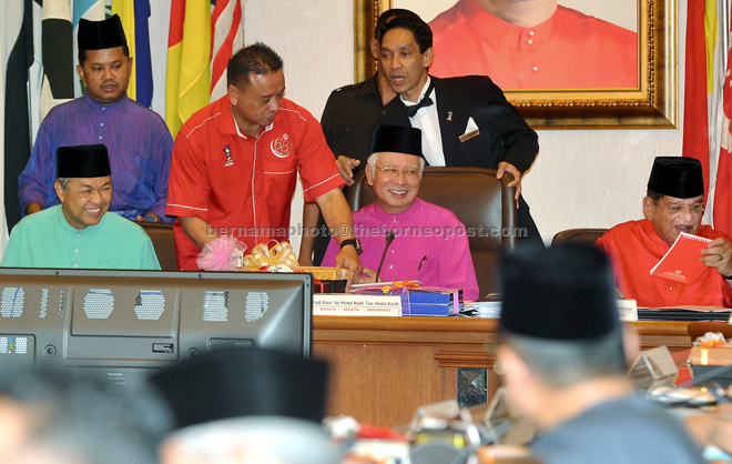 Najib chairing Umno Supreme Council meeting at Menara Dato’ Onn, Putra World Trade Centre yesterday.  He is flanked by Umno deputy president Datuk Seri Ahmad Zahid Hamidi (left) and secretary-general Datuk Seri Tengku Adnan Tengku Mansor. — Bernama photo