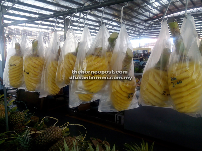 Ready-to-eat pineapples at Asinah’s stall at Sarikei Wet Market.