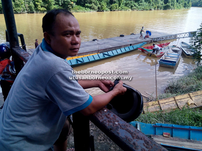 Jeneve waits for a ferry to take him to Majau.