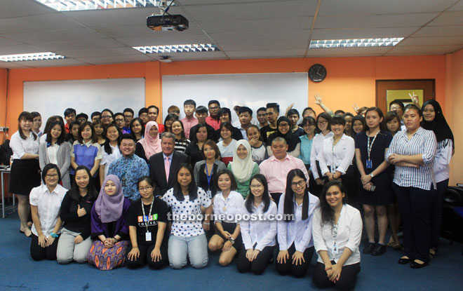 Hospitality students posing with Fulton, an experienced industry practitioner during the visit.