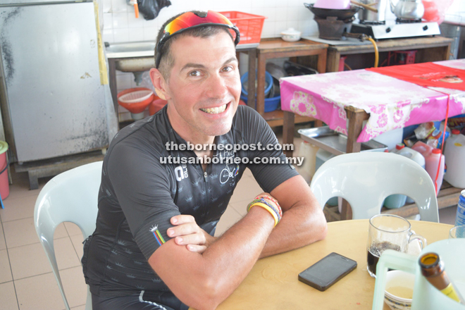 Pedro Blasco having lunch in Kanowit after cycling from Sibu. 