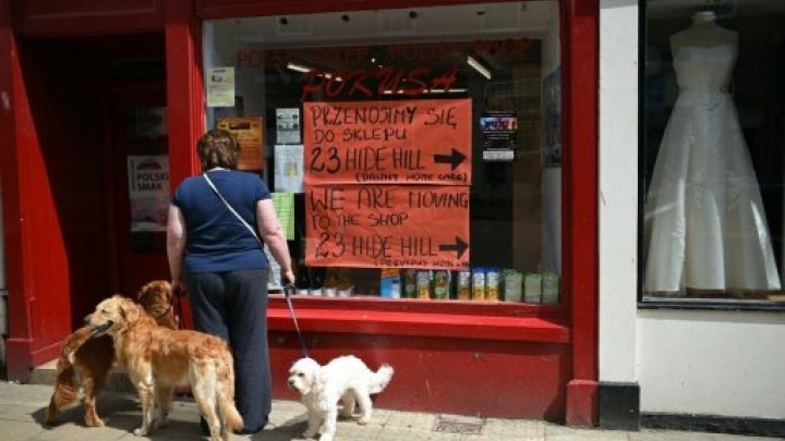 A woman looks in the window of a Polish shop in the centre of Berwick-upon-Tweed in northern England close to the border with Scotland on June 26, 2016. Photo by AFP