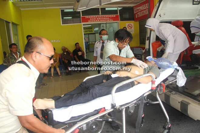 Medical personnel attend to Mohd Zamri upon his arrival at the hospital. He later succumbed to his injuries.