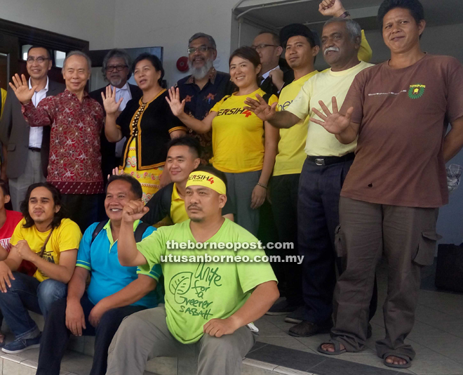 Ex-Suhakam vice-chairman Tan Sri Simon Sipaun (second left) outside the court with Jannie (fourth left) and Ram (third left) yesterday.