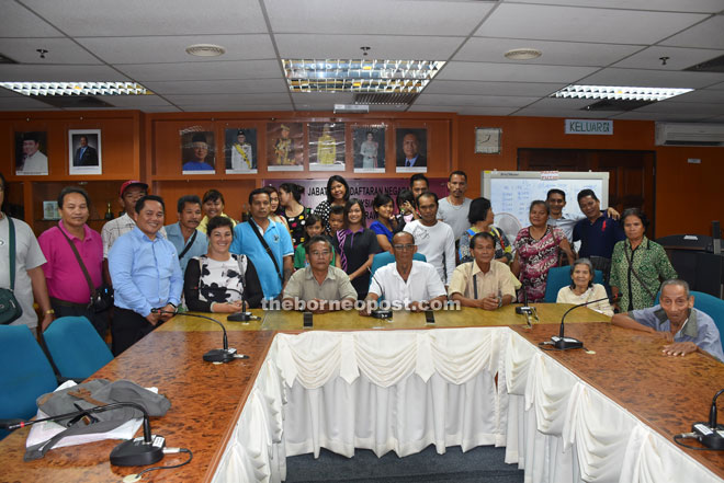 Shepherd (seated left) and Peter (seated third from left) in a photo-call with the applicants and their parents.