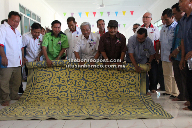 Masing (centre) and others performing the ‘ngiling bidai’ at Rumah Akai, Menusa, Ulu Suai, some 90km from Bintulu yesterday.