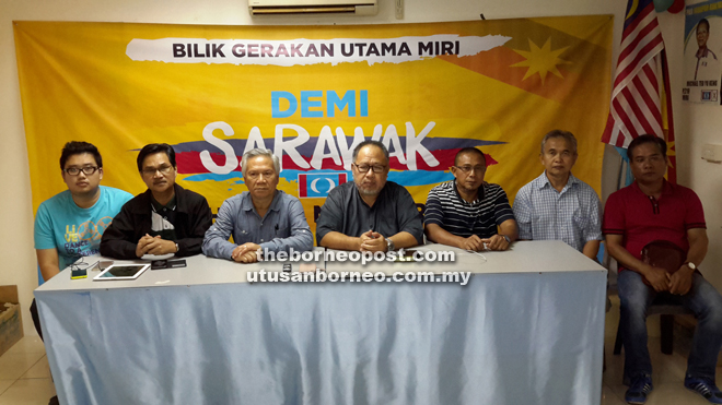 Baharuddin (centre) chairing the press conference.