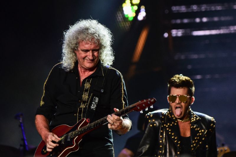 Brian May (L) of British rock band Queen, pictured performing with singer Adam Lambert on September 19, 2015, said presumptive Republican presidential nominee Donald Trump is using the band's song "We Are The Champions" without permission. Photo by AFP