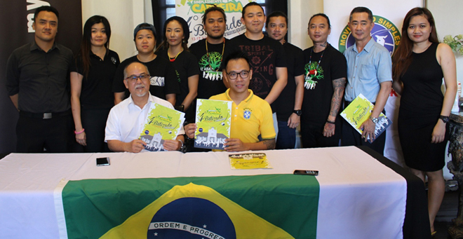 Wu (seated right) and Liew hold the posters with representatives of the sponsors and organising committee during the press conference.