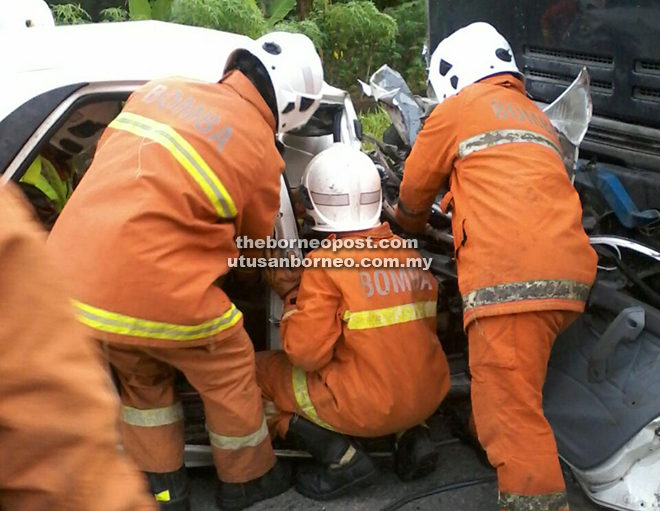 Rescuers take some time to extricate the bodies out of the wreckage.