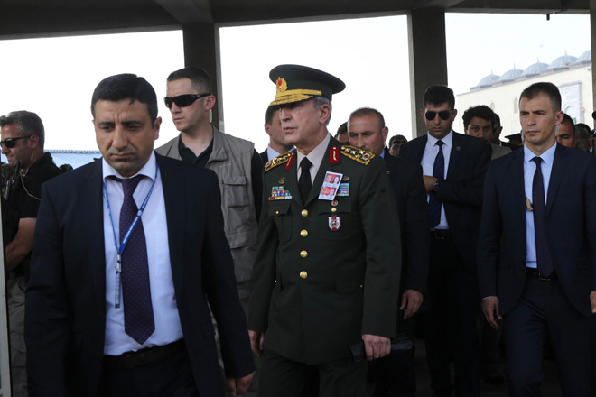 Hulusi Akar (centre), Chief of the General Staff of the Turkish Armed Forces, attends a funeral ceremony in Ankara for police officers killed during the failed July 15 coup attempt. — AFP photo 