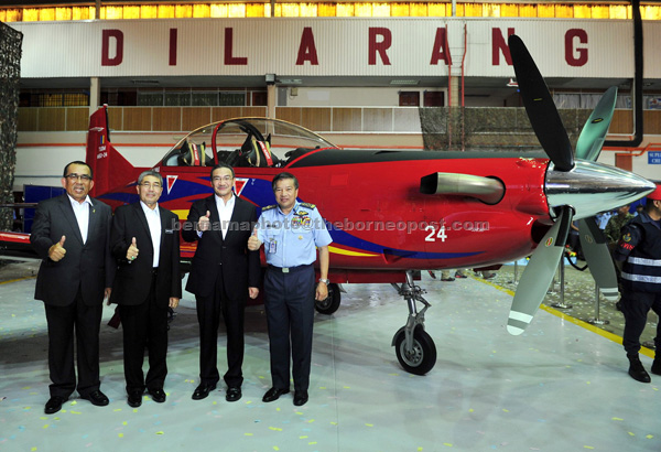 (From left) Johari, Ahmad Bashah, Hishammuddin and Roslan at the RMAF’s Hari Raya celebration and launching of the Pilatus PC-7 Mk II aircraft and EC 120B helicopters. — Bernama photo
