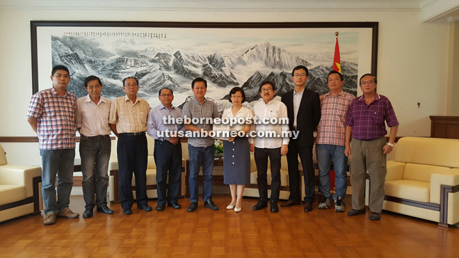 Yong (fifth from left) presenting the invitation letter to Chen while Goh (fourth from right), and from left, Lo, Kwan, Chua, Situl, Chen, Tseu and Tang look on. 