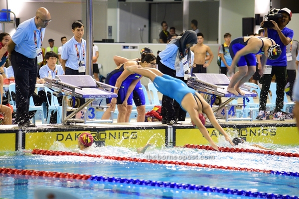 Sarawak women's relay team competing in 4X100 freestyle relay. 