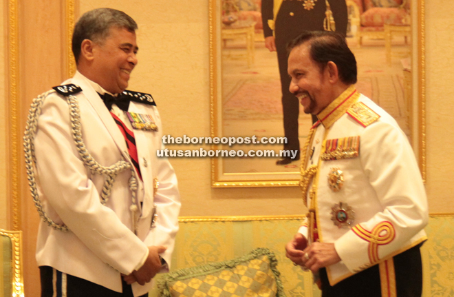 Sultan Hassanal (right) and Khalid share a light moment prior to the royal banquet at Istana Darul Iman.