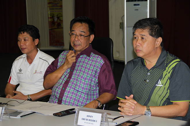 Karim (centre), flanked by Ong (on his left) and Kameri, speaking during the briefing.