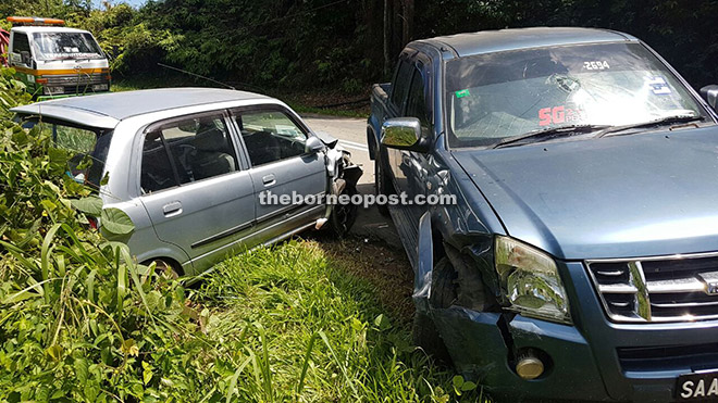 The two vehicles that collided head-on along Jalan Kokol, Manggatal yesterday. 
