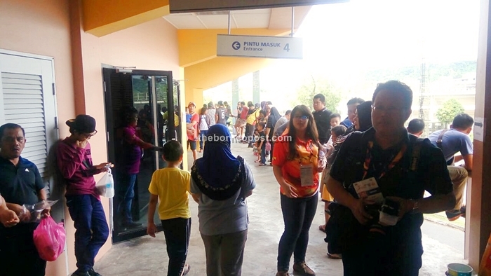 Members of the public waiting outside the stadium after they were advised to go outside.