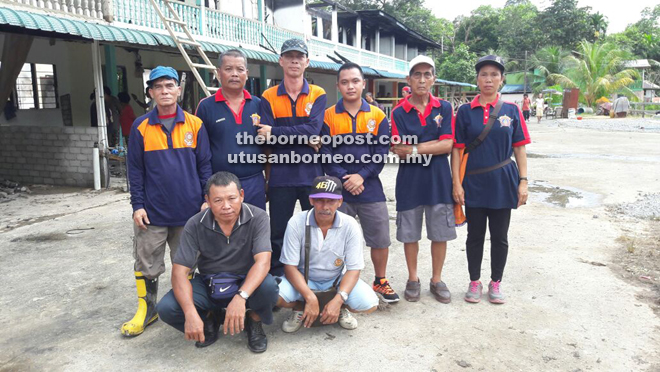 Some of Lubok Lemba PBS members posing with Ambrose (standing second left) in front of the ill-fated Rumah Gandun