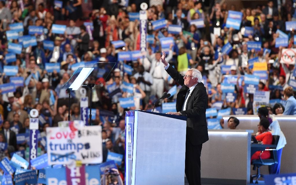 Former presidential candidate Bernie Sanders tells delegates at the Democratic National Convention in Philadelphia that Hillary Clinton must become president. Photo by AFP