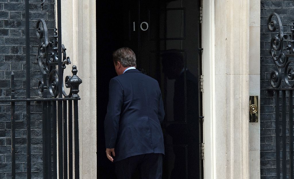 British Prime Minister David Cameron walks back to 10 Downing Street in London on July 11, 2016. Photo by AFP