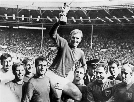  England captain Bobby Moore lifts the Jules Rimet Trophy after victory against West Germany in the World Cup final on July 30, 1966. AFP File Photo