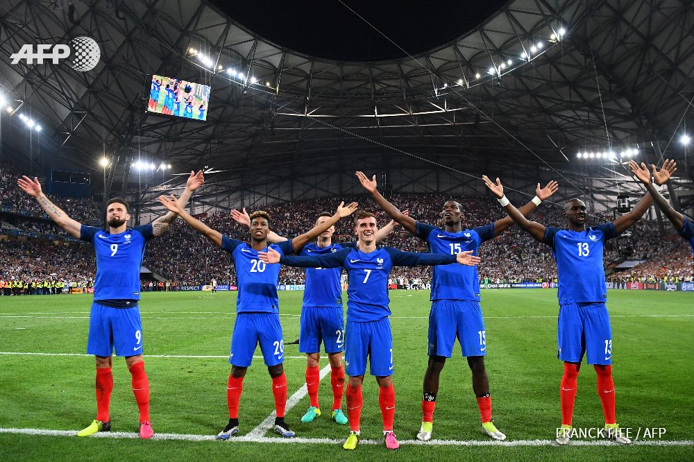France's players celebrate after beating Germany 2-0. Photo by AFP