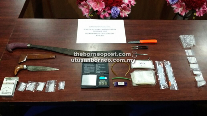 The weapons, packaged drugs and other related paraphernalia seized from the shed.