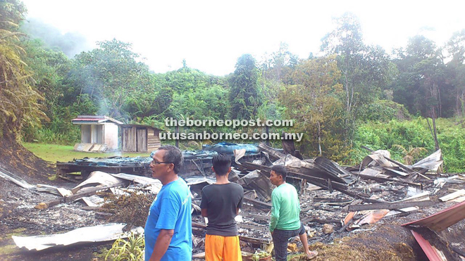 Longhouse folk take a closer look at what’s left of the classrooms.