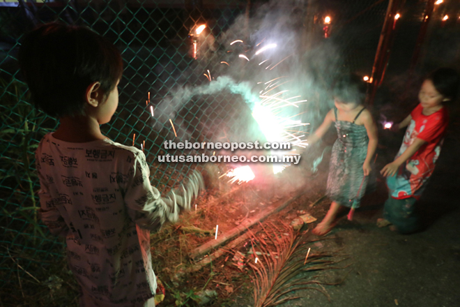 Children playing with the fire crackers.