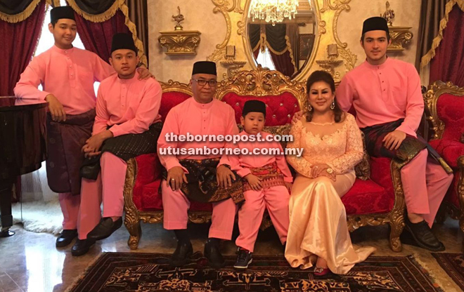 Haris (right) and his family posing for their Hari Raya family photo.