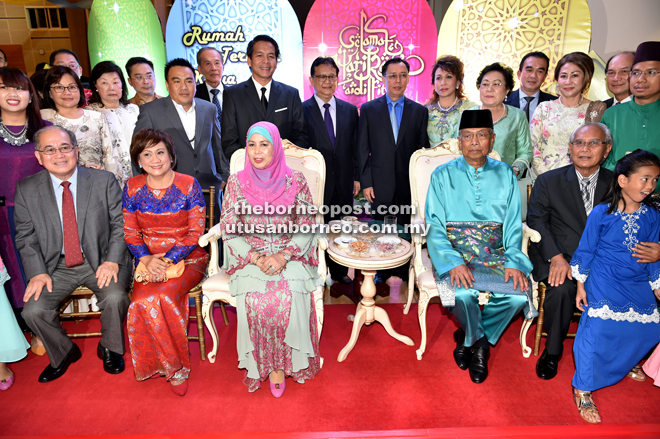 Dr Rundi (back row, seventh right) in a group photo with Adenan (seated second right) and his wife Datin Patinggi Dato Jamilah Anu (seated third left) at Adenan’s Hari Raya Open House during the first day of Raya. — Photo by Chimon Upon