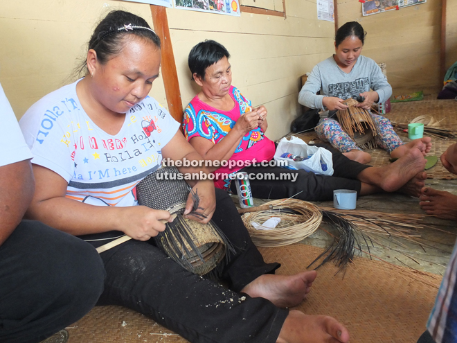 Weavers make the traditional woven handicrafts that the community is well-known for.