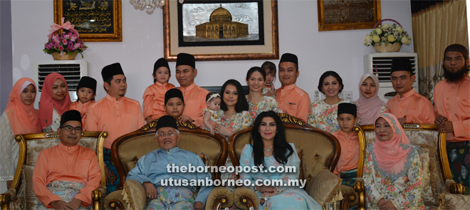 Taib and Ragad seated  with Ahmad Lai (left) and his family members at their residence in Luak. Seated at right is Ahmad Lai’s wife Dayang Lily Abang Indeh.