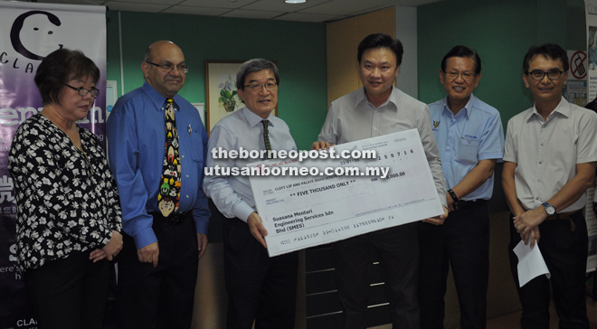 A representative of SMES (third right), handing over a mock cheque to Dr Kim Tan, witnessed by (from left) Yeoh, Dr Joseph Manavalan, Lee and Dr Philip Raja. Brunei-based SMES is a strong supporter and regular donor to the charity project.