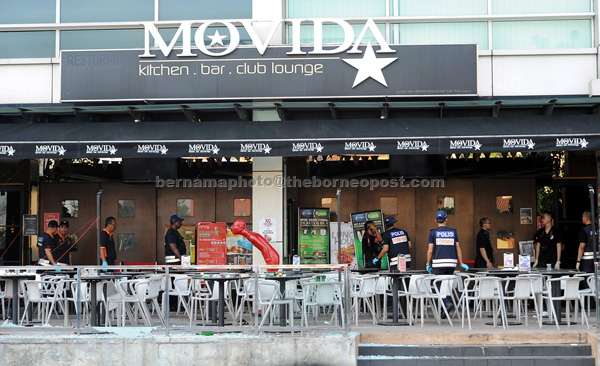 A police forensic team carrying out investigation at the entertainment outlet following the explosion, believed to be from a hand grenade. — Bernama photo