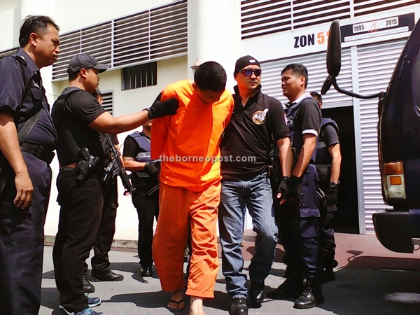 One of the two suspects, Mohamad Fitri Pauzi, 29, charged for the murder of Bill Kayong this morning. 