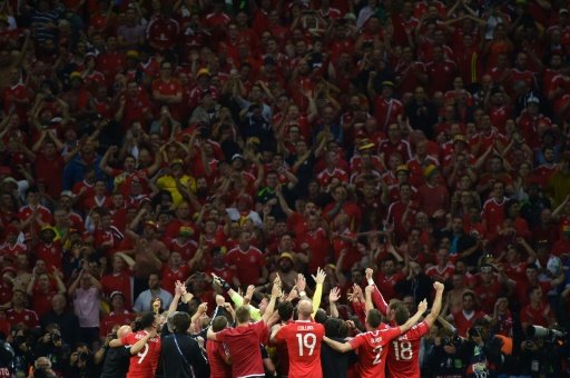 Wales celebrate at the end of their historic Euro 2016 quarter-final against Belgium which sets them up for Wales' first major tournament semi-final. Photo by AFP