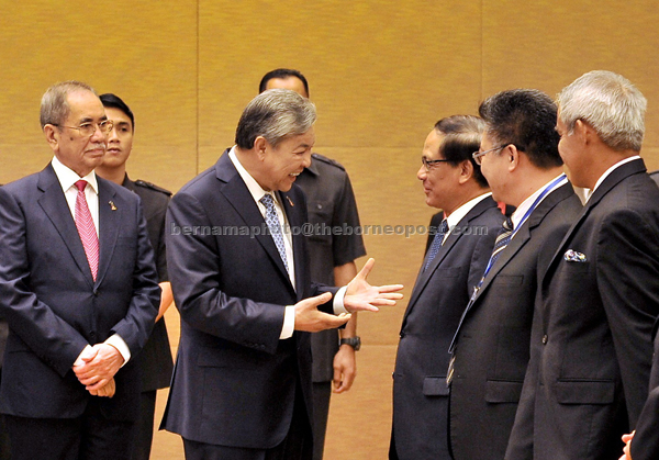 Ahmad Zahid (second left) having a light moment with Asean chief secretary Le Luong Minh (third right) after officiating the ‘Conference of the Parties (COP) to the Asean Agreement on Transboundary Haze Pollution (COP12)’. On the left is Natural Resources and Environment Minister Datuk Seri Dr Wan Junaidi Tuanku Jaafar. — Bernama photo