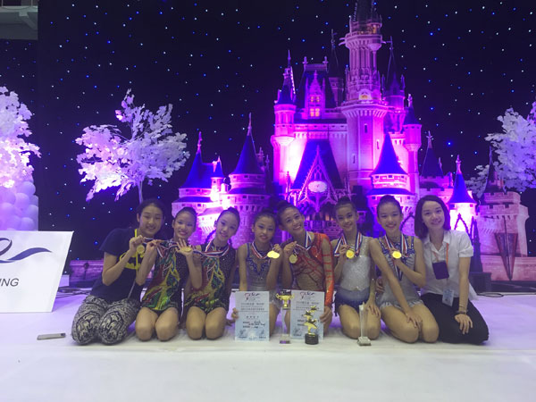 The state gymnasts with coaches Shaleen Tay (right) and Fiona Lee (left) after receiving their medals and certificates.