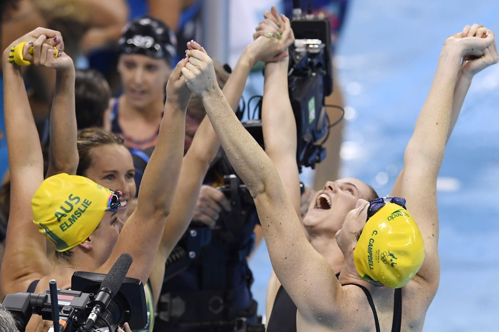 Australia's Brittany Elmslie, Australia's Bronte Campbell, Australia's Emma Mckeon and Australia's Cate Campbell celebrate after they broke the world record to win the Women's 4x100m Freestyle Relay Final during the swimming event at the Rio 2016 Olympic Games at the Olympic Aquatics Stadium in Rio de Janeiro on Aug 6, 2016. Photo by AFP
