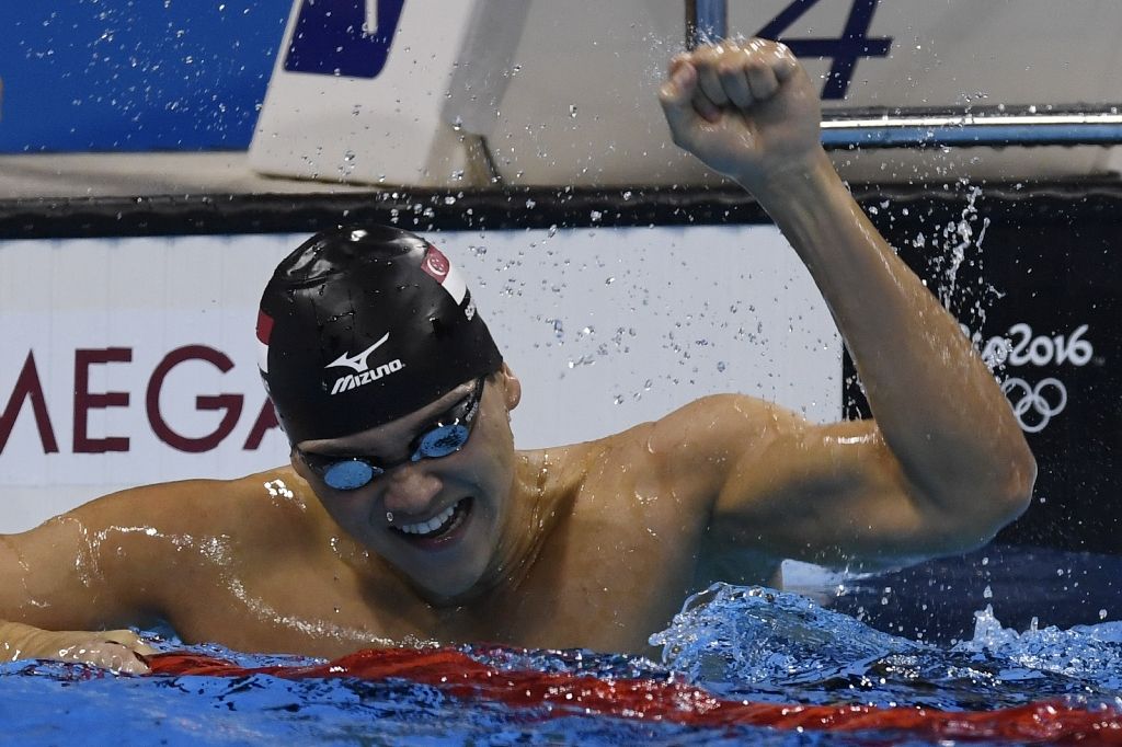 Singapore's Joseph Schooling, 21, won the 100m butterfly final in a Games record 50.39sec. Photo by AFP