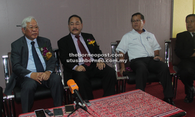 Manyin (left) speaks to the media as (from right) Bukit Semuja assemblyman John Ilus, Kedup assemblyman Martin Ben and Assistant Minister for Public Utilities (Water Supply) Roland Sagah look on.