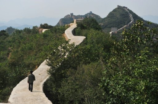 A villager walks on a paved-over section of the Great Wall of China at Suizhong, in the northeast Liaoning province on September 21, 2016-AFP Photo